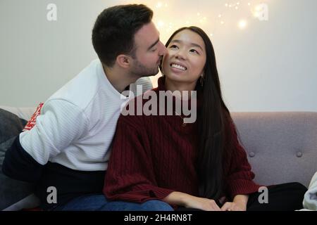 Man with Christmas surprise present for his girlfriend. Stock Photo