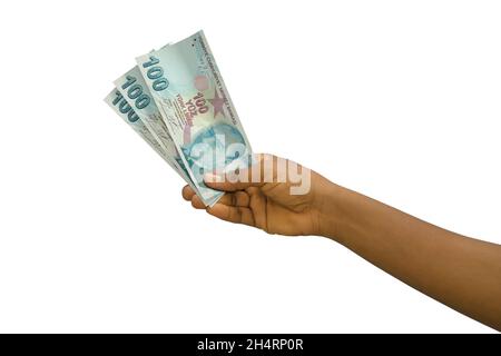 Fair hand holding 3D rendered Turkish Lira notes isolated on white background Stock Photo