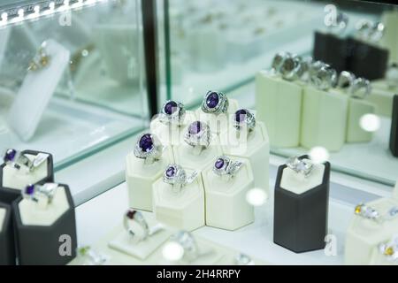 Artificial jewelry stones in the jewelry store window Stock Photo