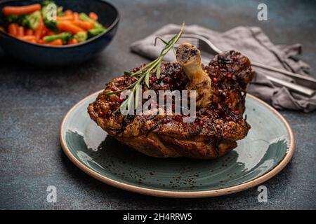 Roasted pork knuckle and salad angle view Stock Photo