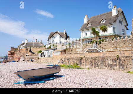 Sidmouth Devon Sidmouth beach Small boat on the pebble beach under Rock Cottage Hotel and the Beacon Sidmouth Town Sidmouth Devon England UK GB Europe Stock Photo
