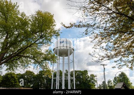 A tall white municipal water tower marked with the letters PWSD in Lone Jack, Missouri, in the United States. Stock Photo