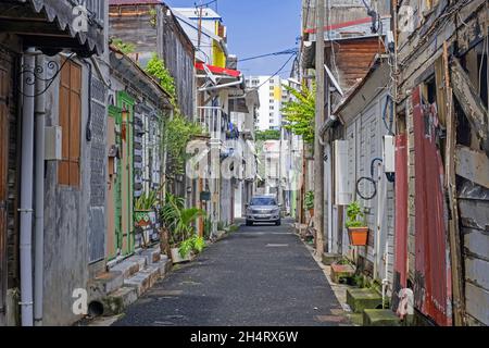 Alley in the old French colonial city centre of Pointe-à-Pitre, Grande-Terre at Guadeloupe, Lesser Antilles in the Caribbean Sea Stock Photo