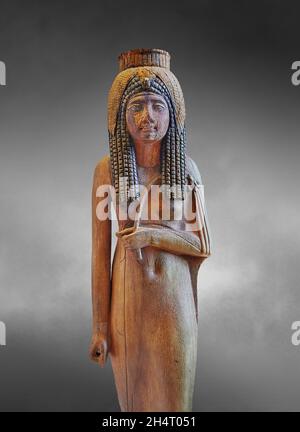 Egyptian Wood Sculpture of the deified queen Ahmes Nefertari, 1279-1213 BC 19th Dynasty, found Deir el Medina,  acacia.  Louvre Museum  inv N 470.  Th Stock Photo