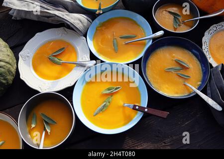 Thanksgiving concept with pumpkin, pumpkin soup .Fall table setting for celebration Autumn holiday with soup. Stock Photo