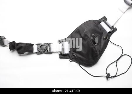 fashionable motorcycle mask, black, on a white background is on the right of the frame Stock Photo