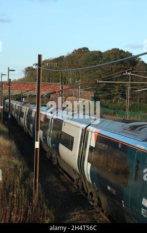 Avanti West Coast class 390 pendolino electric multiple-unit train on West Coast Main Line railway in countryside in Lancashire 4th November 2021. Stock Photo