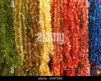 New Year and Christmas tinsel of different colors background texture Stock Photo
