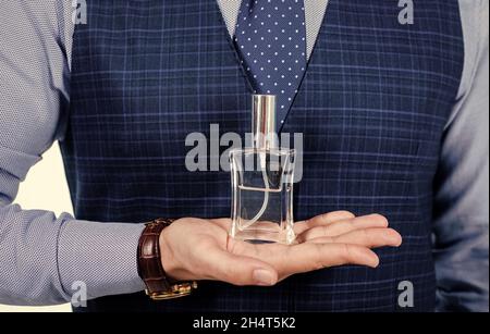 Perfumer Assistant cologne for men. Perfumer shop assistant guy presenting product. Man ...