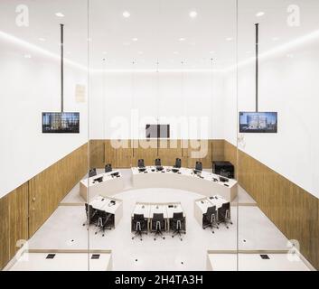 Courtroom interior viewed from the viewing gallery. Courthouse Amsterdam, Amsterdam, Netherlands. Architect: KAAN, 2021. Stock Photo