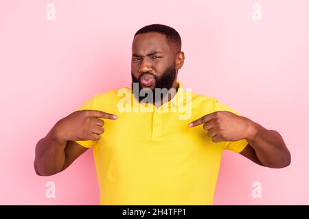 Photo of afro american unhappy upset young man look point finger himself blame isolated on pink color background Stock Photo