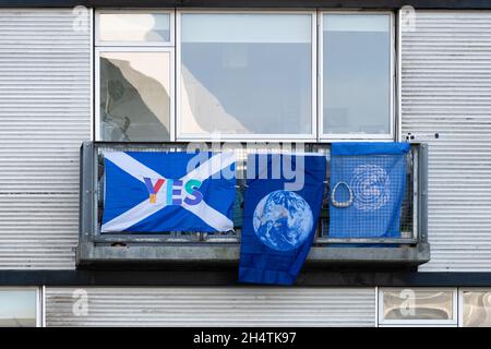 Flags on apartment balcony overlooking the COP26 SEC venue - Scottish Independence flag, United Nations Flag, Glasgow, Scotland, UK Stock Photo