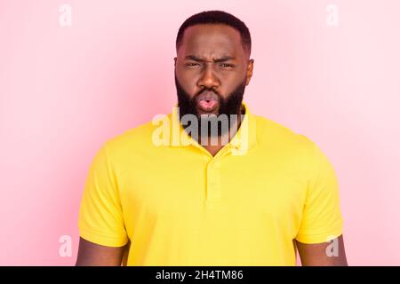 Portrait of attractive confused funky virile guy pout lips isolated over pink pastel color background Stock Photo