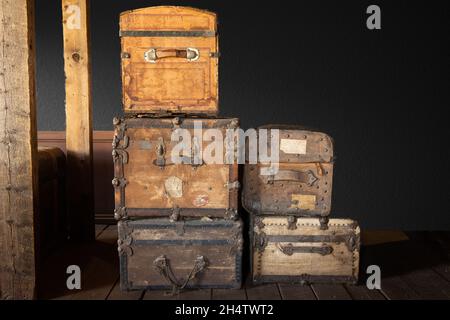 Stack of old travel trunks in a railroad station Stock Photo