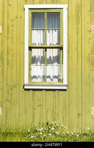 Old green window on barn Stock Photo