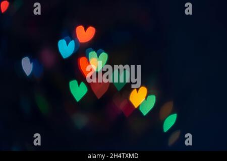 Abstract blurry defocused bokeh image in the shape of a heart. Noise is visible in the image Stock Photo