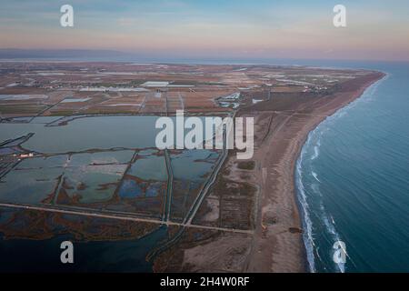 Aerial view of marshes, the Tancada lagoon, rice fields, Eucaliptos beach and l´Alfaca beach;  Sant Carles de la Rapita, Ebro Delta, Natural Park, Tar Stock Photo