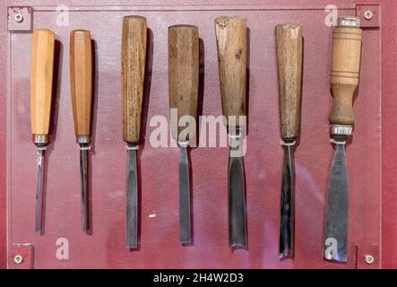 Old carpenter tools: chisels of different shapes and sizes. Stock Photo