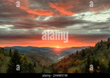 A dramatic autumn sunrise unfolds over the Oconaluftee Valley in Great Smoky Mountains National Park.