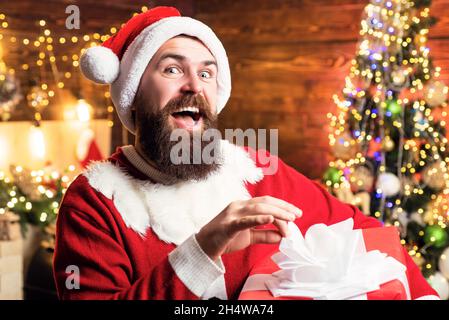 Design Gift Handmade. Crazy, funny Hipster Santa. Delivery gifts. Gift emotions. Stock Photo