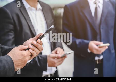 Business groups are using mobile phones to make business contacts, trade, communications, stocks, finance, technology. Stock Photo