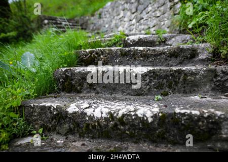 Shallow depth of field (selective focus) image with medieval stone steps from inside the Bran Castle, known also as Dracula’s Castle in Transylvania, Stock Photo