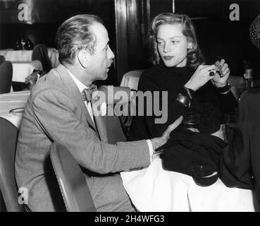 HUMPHREY BOGART and his wife LAUREN BACALL at the Stork Club night club in Manhattan New York City in 1949 Stock Photo