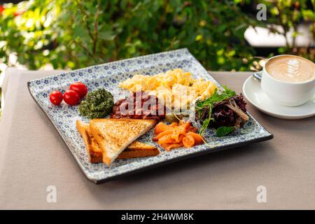 Served rustic breakfast with cappuccino coffee Stock Photo