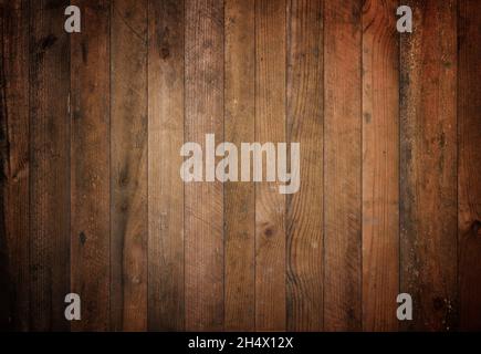 Dark old barn wood background texture. Vintage weathered rough planks backdrop. Stock Photo