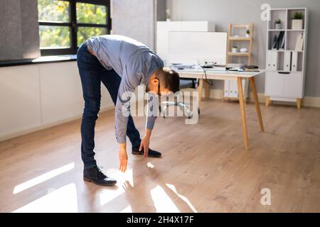 Stretching Exercise Standing In Front Of Computer Stock Photo