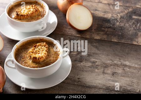 French onion soup on wooden table Stock Photo