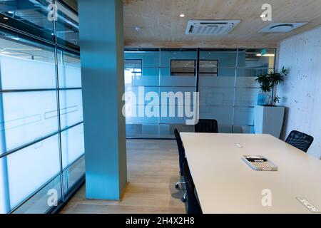 Empty modern board room with conference table and glass walls in office Stock Photo