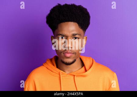 Photo of young handsome african guy serious confident concentrated isolated over purple color background Stock Photo
