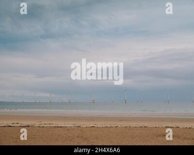 The empty sandy beach and offshore wiind farm / windfarm at Redcar Cleveland North Yorkshire England UK - North Yorkshire coast Stock Photo