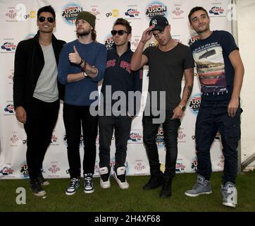 The Wanted (L-R) Siva Kaneswaran, Jay McGuiness, Nathan Sykes, Max George and Tom Parker pose backstage on day 2 of the Fusion Festival on September 1, 2013 in Cofton Park Birmingham, England. Stock Photo