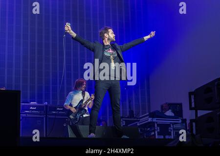 Tom Meighan of Kasabian live on stage during their largest ever home coming Summer Solstice concert on 21st June 2014 at Victoria Park - Leicester Stock Photo