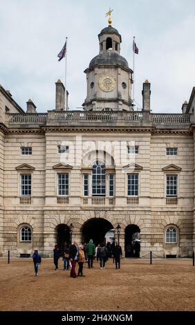 Tourists passing through the arch from Horseguards Parade to Whitehall, London, England Stock Photo