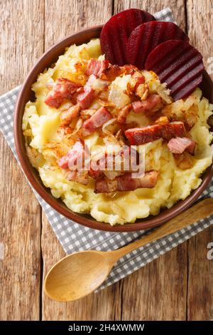 Traditional recipe for Danish Burning Love also known as Braendende Kaerlighed close-up in a plate on the table. Vertical top view from above Stock Photo