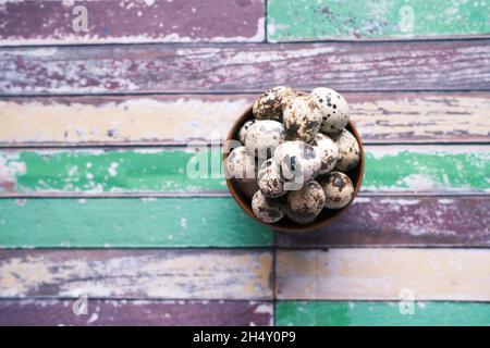 Quails eggs in a bowl on table top view  Stock Photo