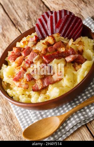 Traditional recipe for Danish Burning Love also known as Braendende Kaerlighed close-up in a plate on the table. Vertical Stock Photo