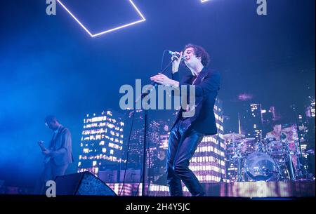 Matthew Healy, George Daniel and  Adam Hann of The 1975 performing live on stage at the Barclaycard Arena on March 22 2016 in Birmingham, United Kingdom. Stock Photo