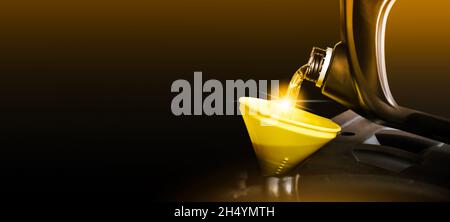 Mechanic pouring motor oil to engine with horizontal copy space on black background Stock Photo