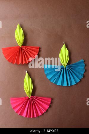 Colorful Diwali lamps made with origami paper on blue background Stock Photo