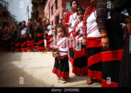 Lalitpur, Bagmati, Nepal. 5th Nov, 2021. Girls in a traditional attire during a parade of Nhu Dan (the Newari New Year), which falls on Tihar or Deepawali and Dewali Festival of Lights at Khokana, Lalitpur, Nepal on Friday, Nov 5, 2021. Credit: Amit Machamasi/ZUMA Wire/Alamy Live News Stock Photo