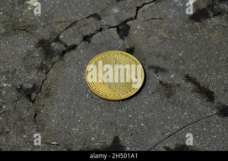 Bitcoin is on a cracked and broken floor Stock Photo