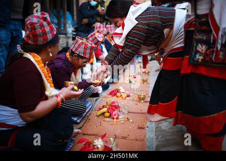 Lalitpur, Bagmati, Nepal. 5th Nov, 2021. People take part in a mass Mha: Puja meaning worshipping oneself or body at Khokana of Lalitpur District of Nepal. Mha: Pooja is conducted on fourth day of five days Tihar festival in Nepal especially by Newa: community. Credit: Amit Machamasi/ZUMA Wire/Alamy Live News Stock Photo