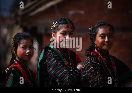 Lalitpur, Bagmati, Nepal. 5th Nov, 2021. Girls in a traditional attire poses for a photo during a parade of Nhu Dan (the Newari New Year), which falls on Tihar or Deepawali and Dewali Festival of Lights at Khokana, Lalitpur, Nepal on Friday, Nov 5, 2021. Credit: Amit Machamasi/ZUMA Wire/Alamy Live News Stock Photo