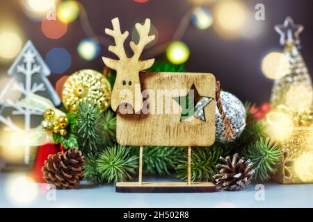 Holiday time. Happy New Year. Space for text.Christmas composition. Frame made of pine branches, fir cones on rustic vintage wooden background. Stock Photo