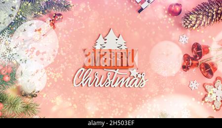 Christmas pink background with gift boxes, decorations and fir branches Stock Photo