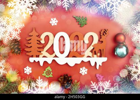 Christmas minimalism holidays composition on red background with copy space for your text 2022 Stock Photo